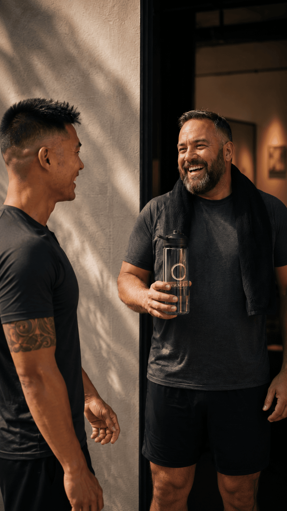 Water bottle, two men outdoors